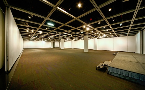 Exhibition Hall - versatile set up with full  height movable display boards and ceremonial stage